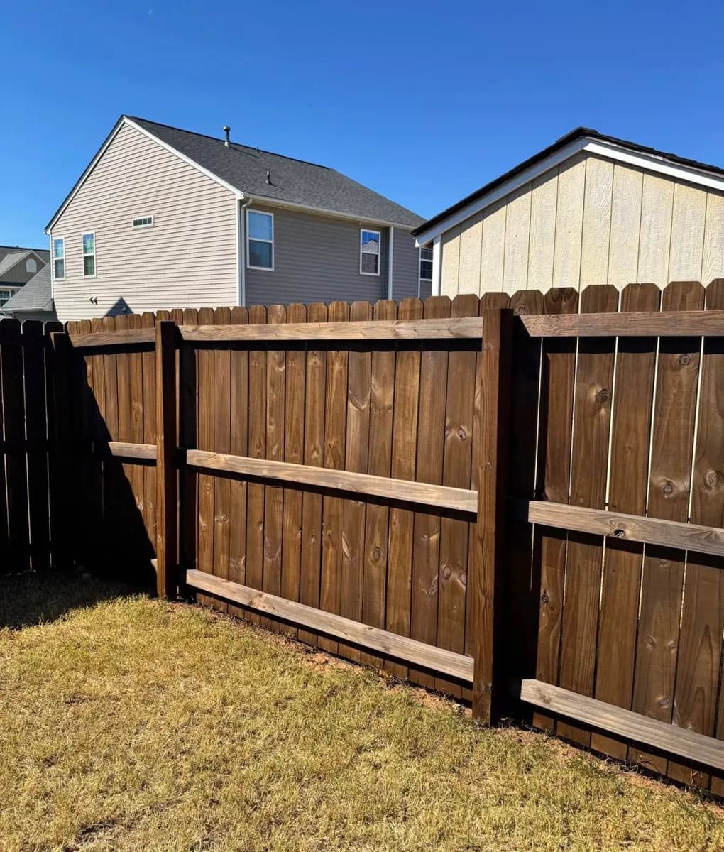 Dark-Stained Shadowbox Fence & Gate completed in Landrum, SC by Stateside Fence and Deck