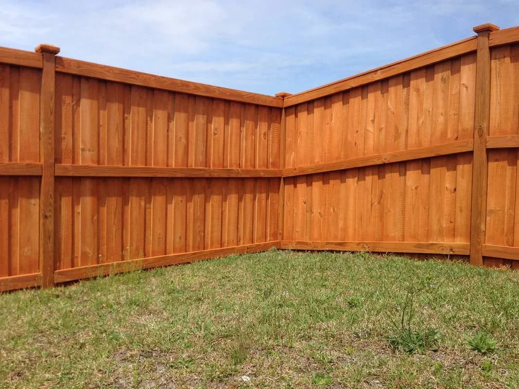 Freshly Stained Cedar Privacy Fence completed in Columbus, NC by Stateside Fence and Deck